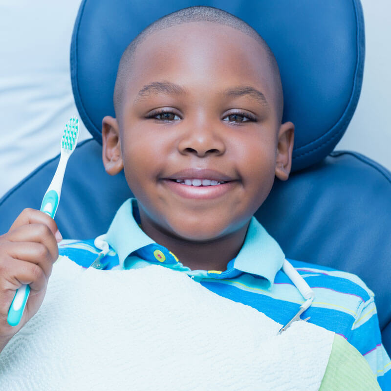 Child On Chair With Toothbrush